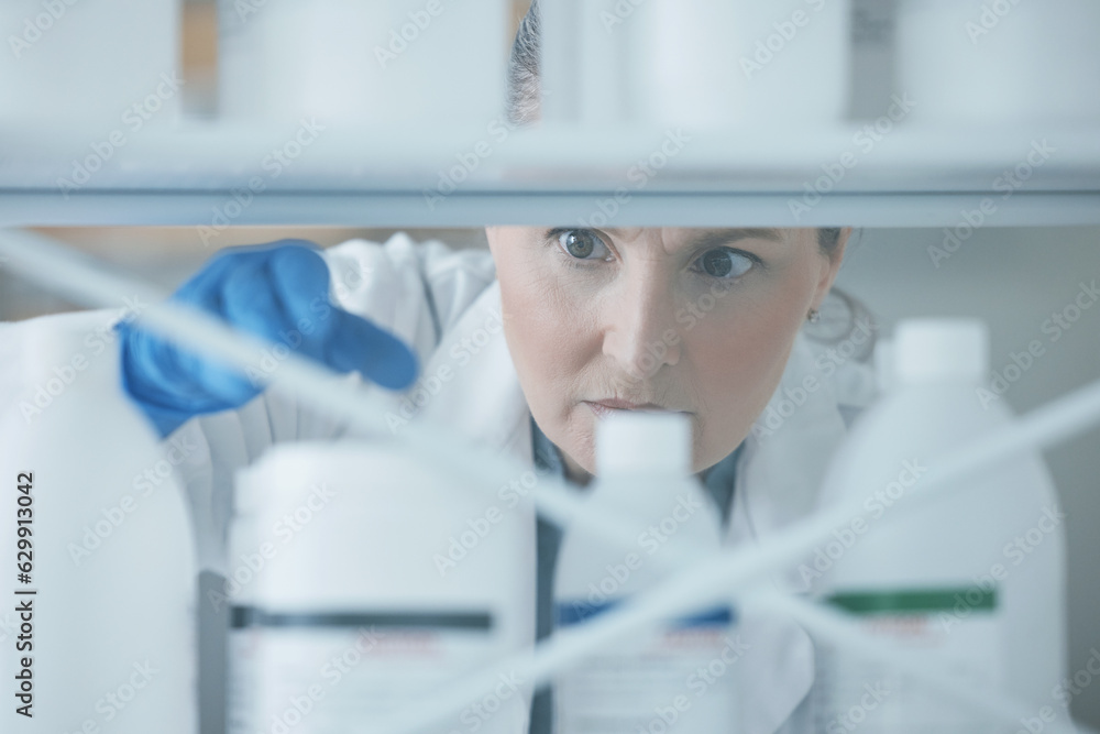 Scientist woman, shelf and bottle in lab with choice, thinking or idea for experiment, innovation or