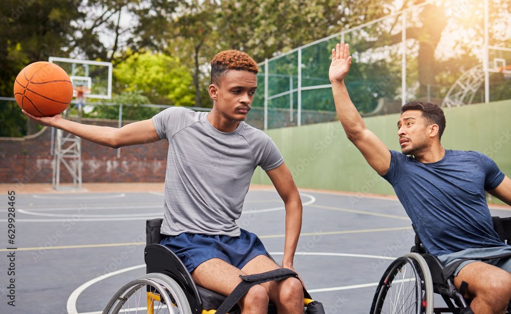 Sports, basketball and men in wheelchair for training, exercise and workout on outdoor court. Fitnes