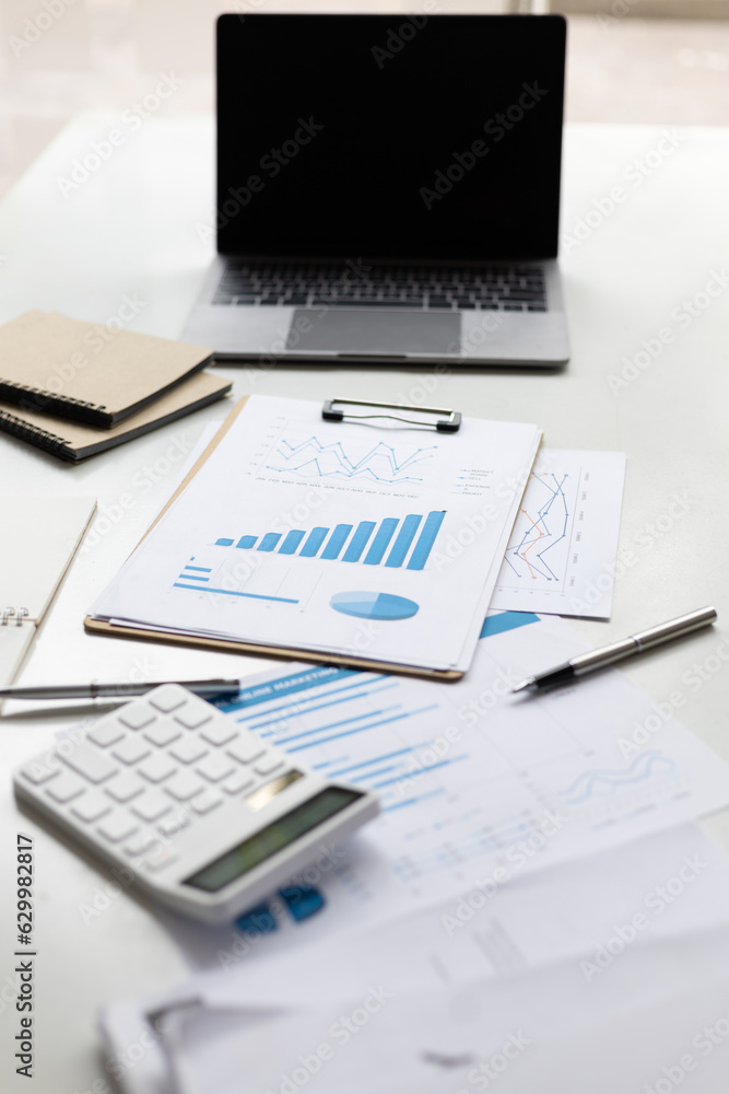 Finance and accounting paperwork on office desk.