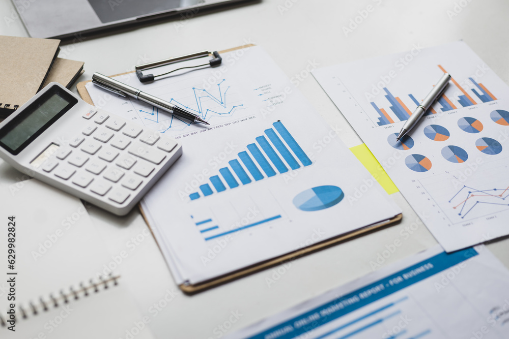 Finance and accounting paperwork on office desk.