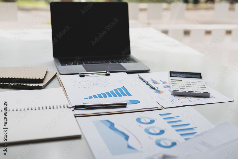 Finance and accounting paperwork on office desk.