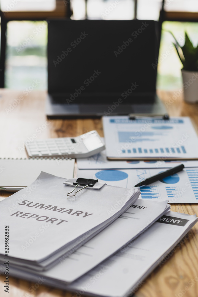 Finance and accounting paperwork on office desk.