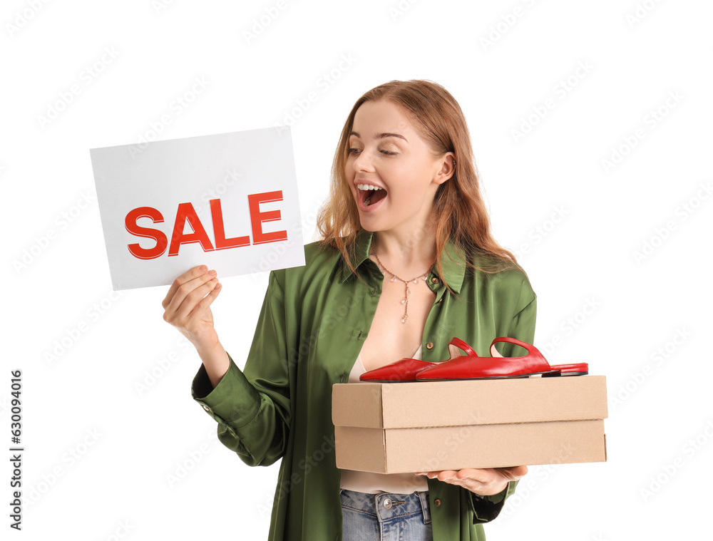 Young woman with sale sign and shoe box on white background