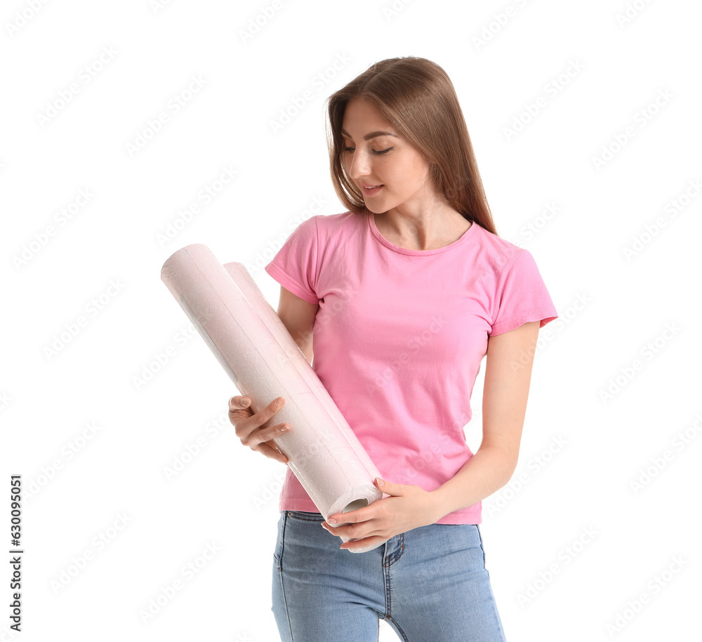 Young woman with wallpaper rolls on white background