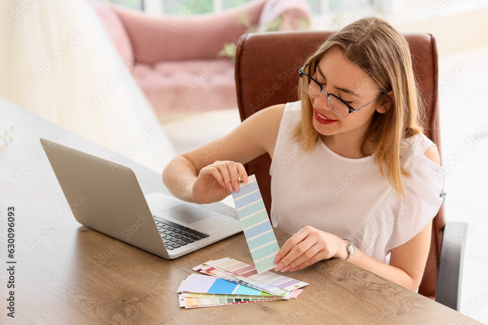 Female wedding planner working with color palettes in office