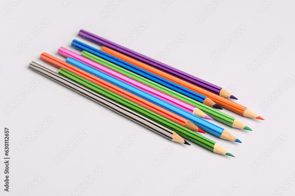 Set of color pencils on light background