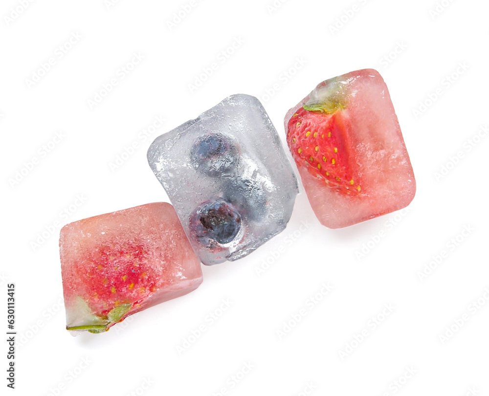 Frozen berries in ice cubes on white background