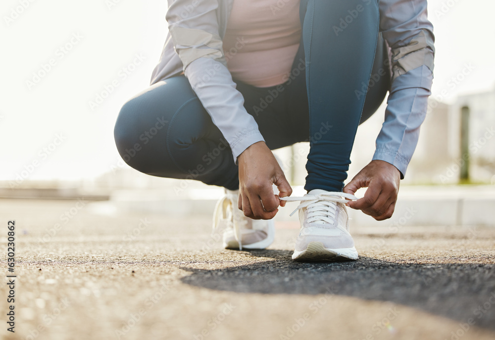 Fitness, runner and woman tie shoes outdoor in the road for running workout in the city. Sports, hea