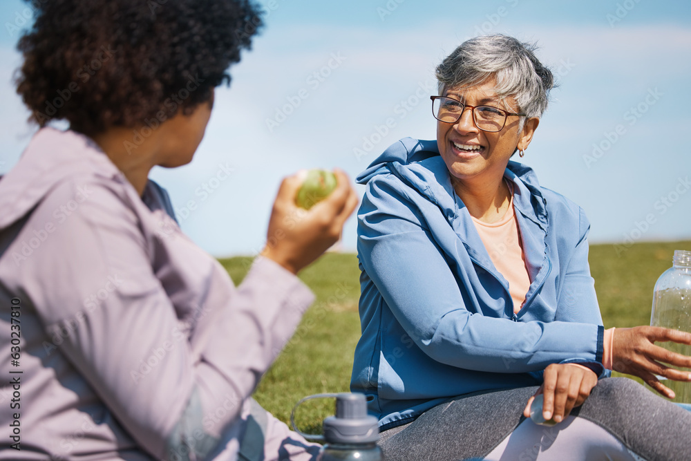 Talking, exercise and senior women friends on the grass outdoor taking a break from their workout ro