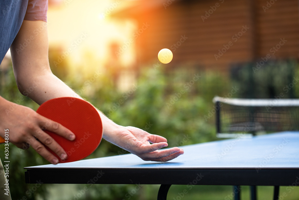 table tennis player doing a serve, close-up, The concept of sport and healthy lifestyle.