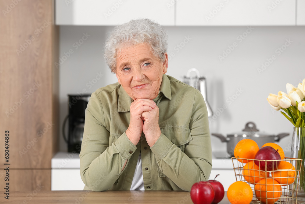 Portrait of senior woman in kitchen