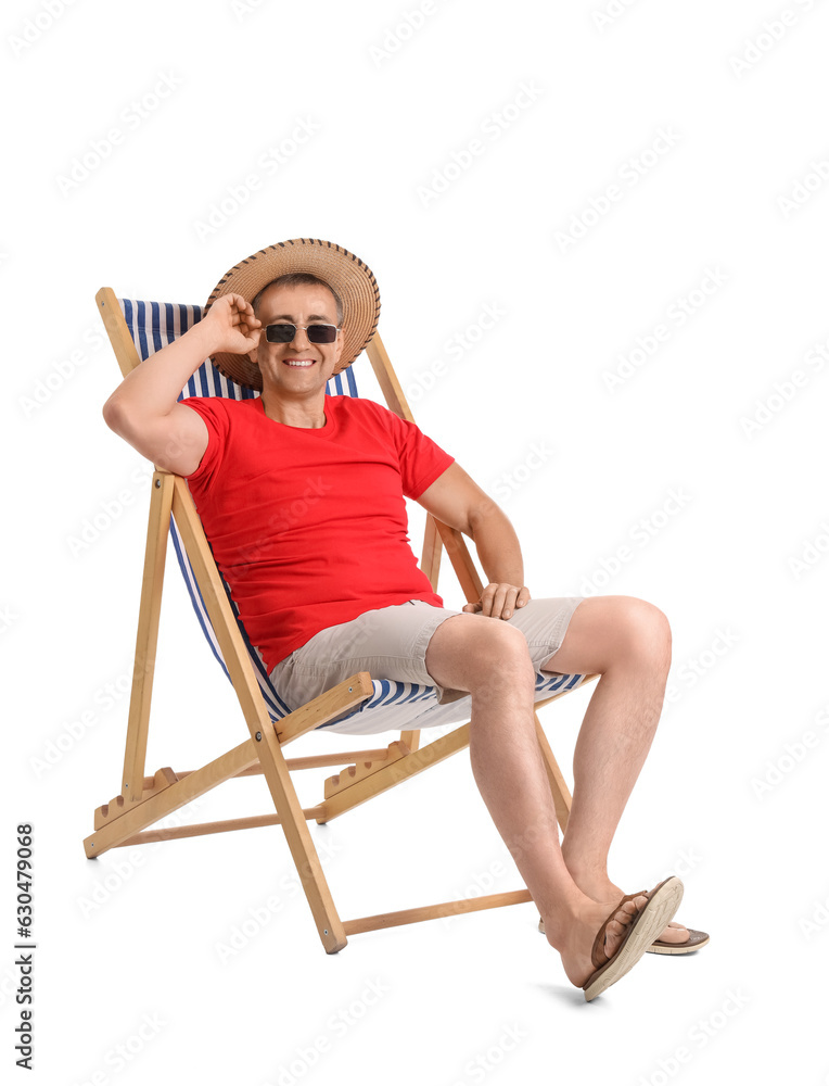 Mature man relaxing in deck chair on white background