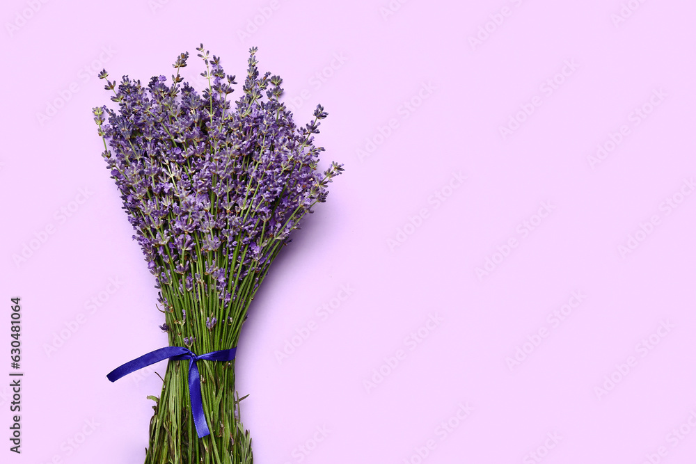 Bouquet of beautiful lavender flowers on purple background