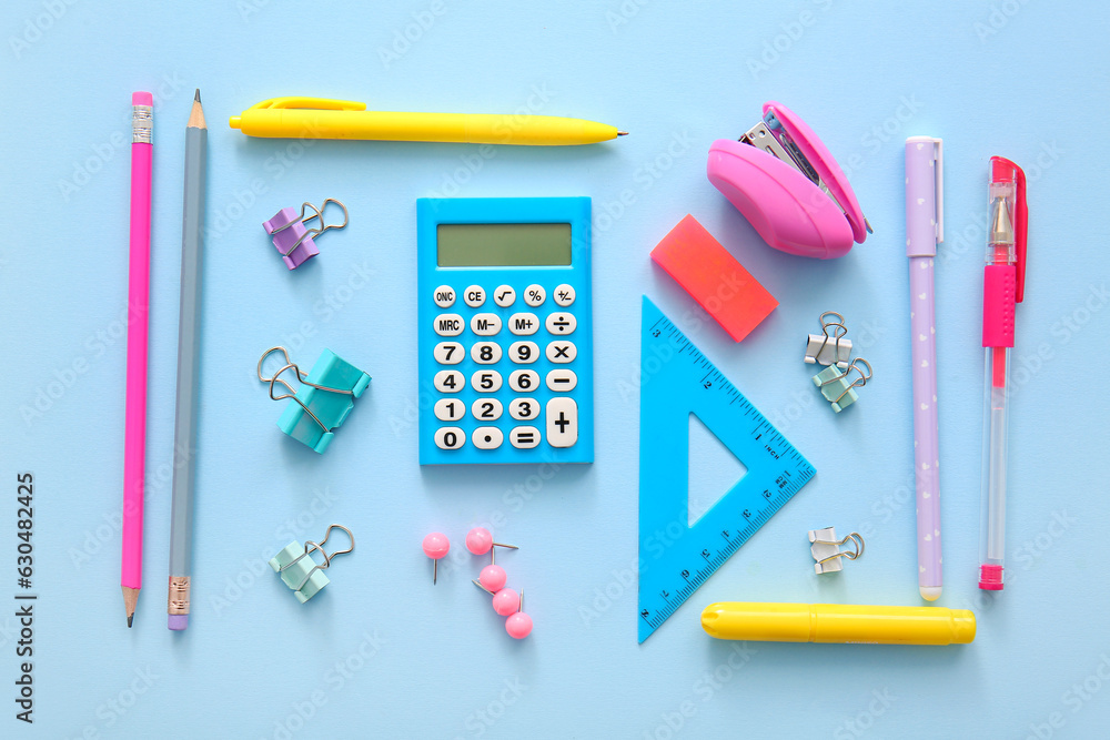 Different school stationery on blue background