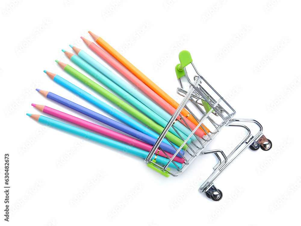 Shopping cart with colorful pencils on white background