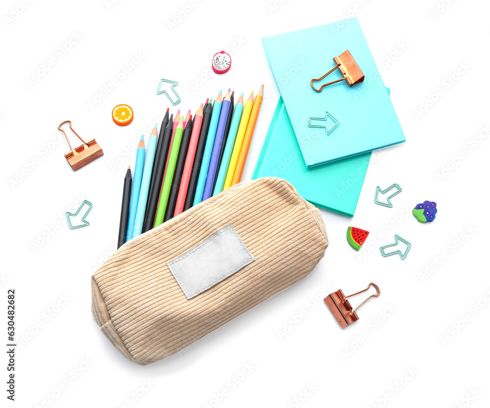 Notebooks and school stationery on white background