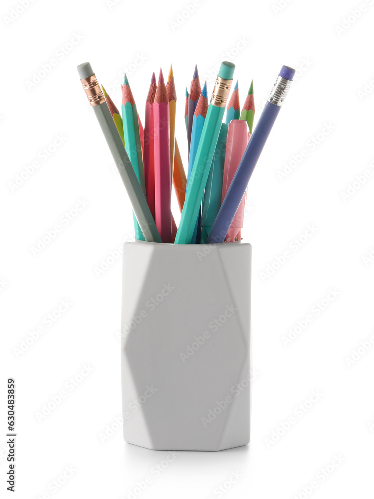 Holder with different color pencils on white background