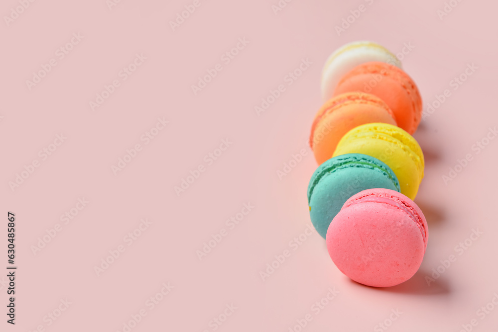 Sweet macaroons on pink background