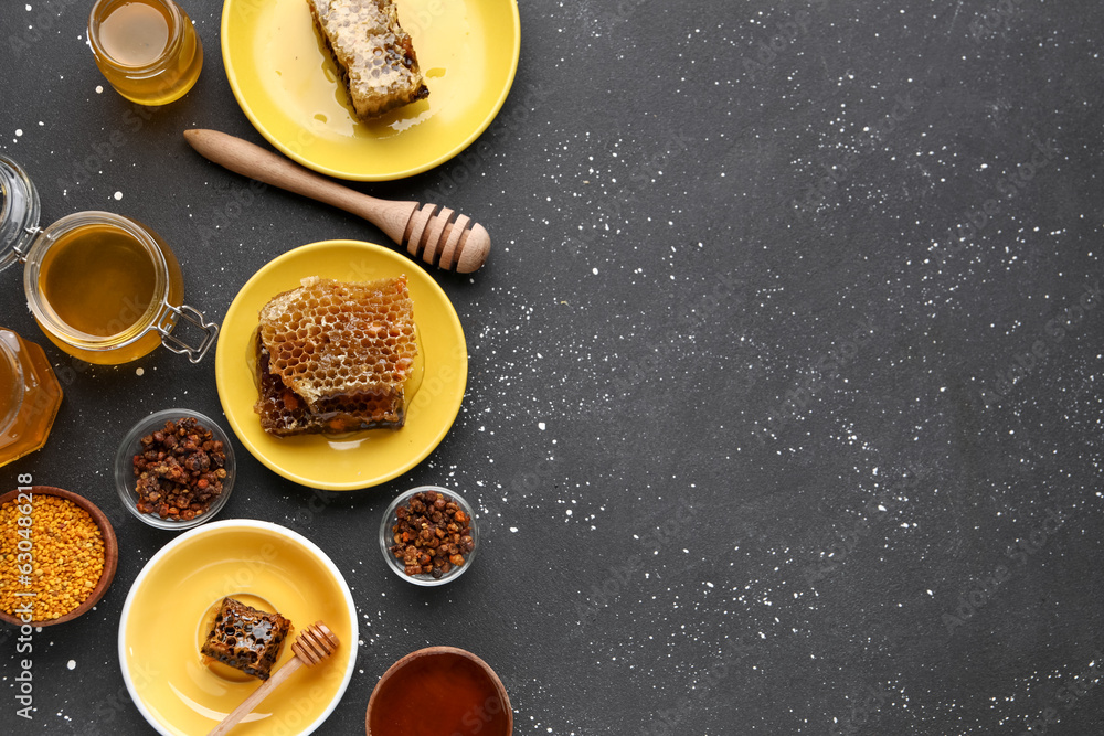 Sweet honey, combs and bee pollen on black background