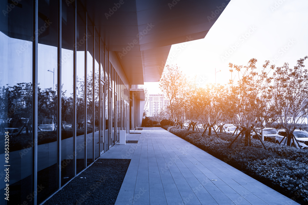 Street view of the entrance and exit of the financial district office building with a blue backgroun