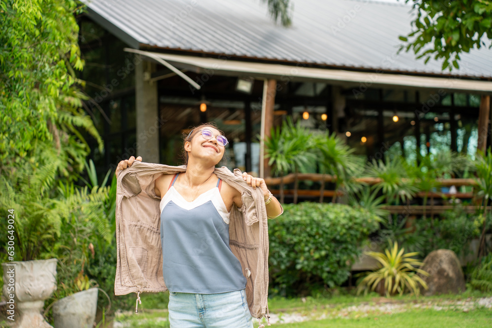 beautiful Refreshed woman in the Graden. Happy woman at Coffee Shop Garden.