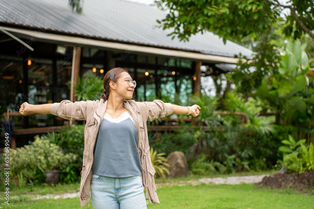 beautiful Refreshed woman in the Graden. Happy woman at Coffee Shop Garden.