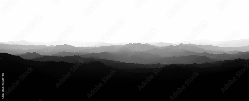 Landscape of hills in misty and foggy light. Black and white. Copy space.