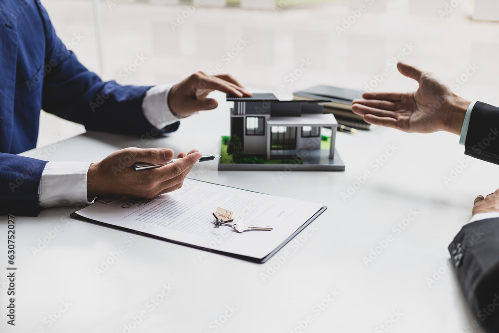 Real estate agents negotiate for businessmen to legally sign home purchase agreements contract , ren