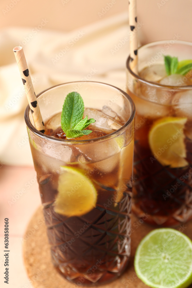 Glasses of cold Cuba Libre cocktail on table