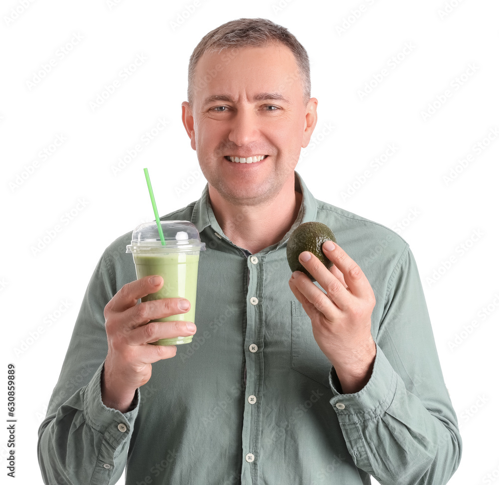 Mature man with glass of vegetable smoothie and avocado on white background