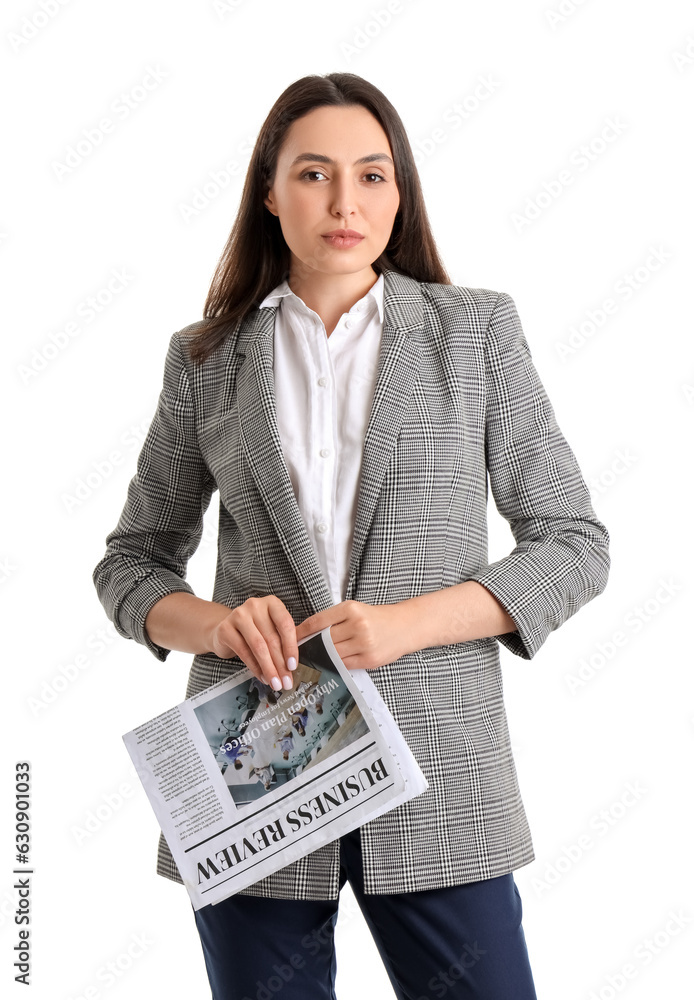 Young woman in stylish suit with newspaper on white background