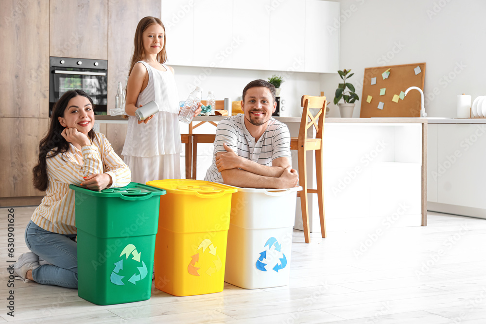 Family with recycle trash bins in kitchen