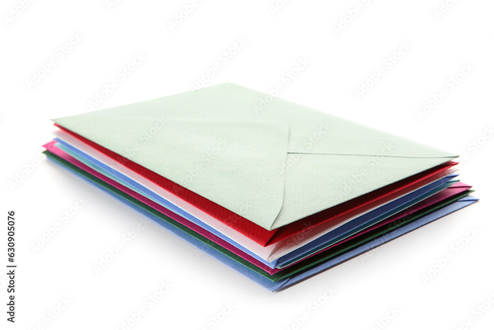 Stack of envelopes on white background