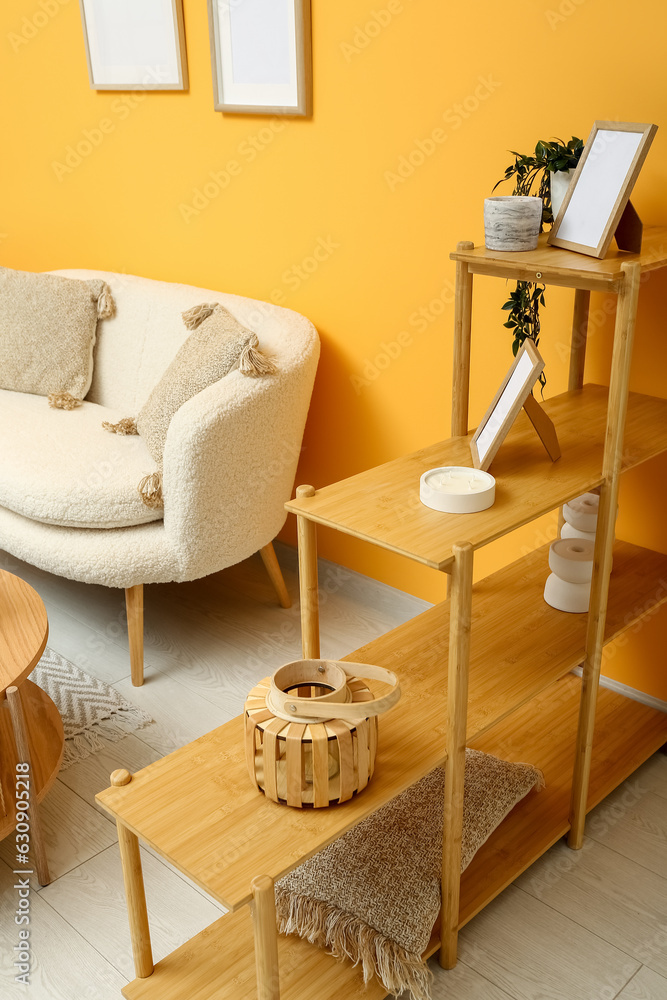 Modern living room interior with shelving unit and comfortable white sofa