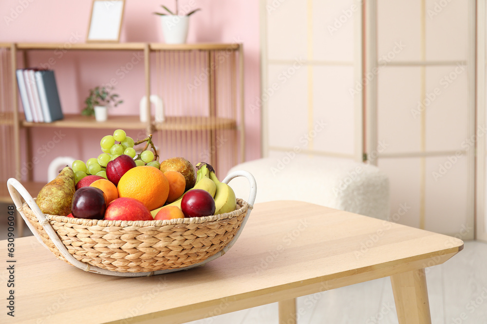 Fruit basket on coffee table in living room, closeup