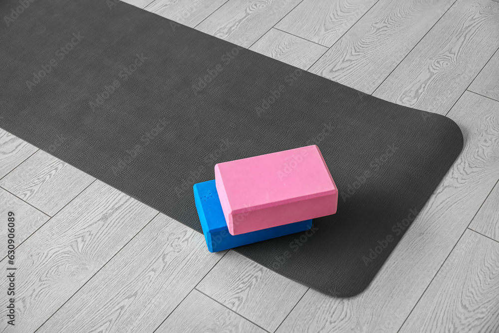 Blocks on yoga mat in living room