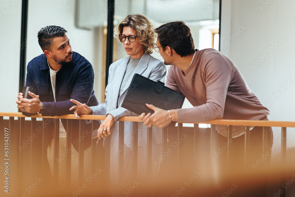 Business woman talks to her colleagues about a project in an office