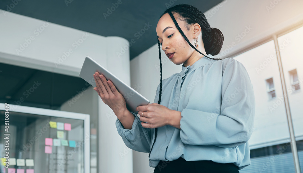 Woman in office on tablet, research and checking email with sticky note ideas on moodboard, business