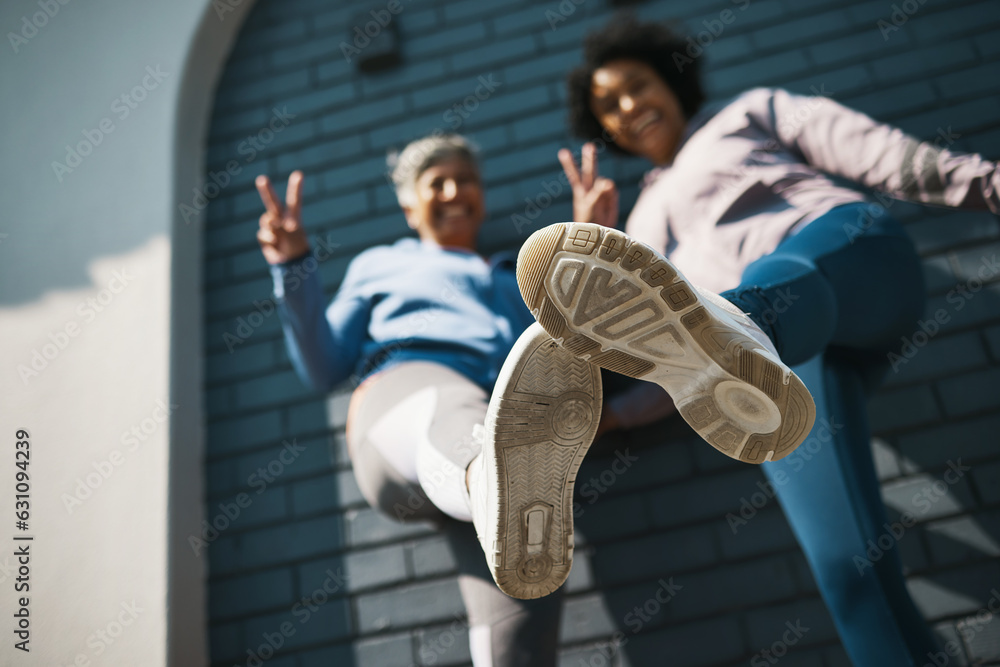 Bottom view, women shoes and closeup with portrait, peace sign and smile outdoor. Wall, mature femal