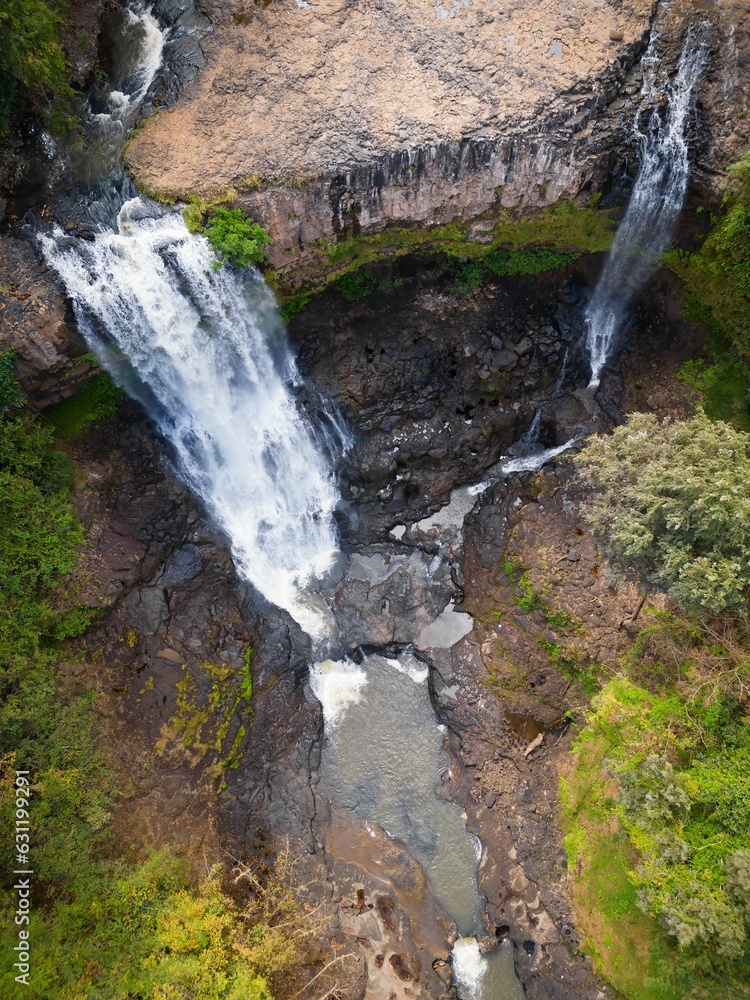 Bousra waterfall with long exposure in the daylight in Cambodia