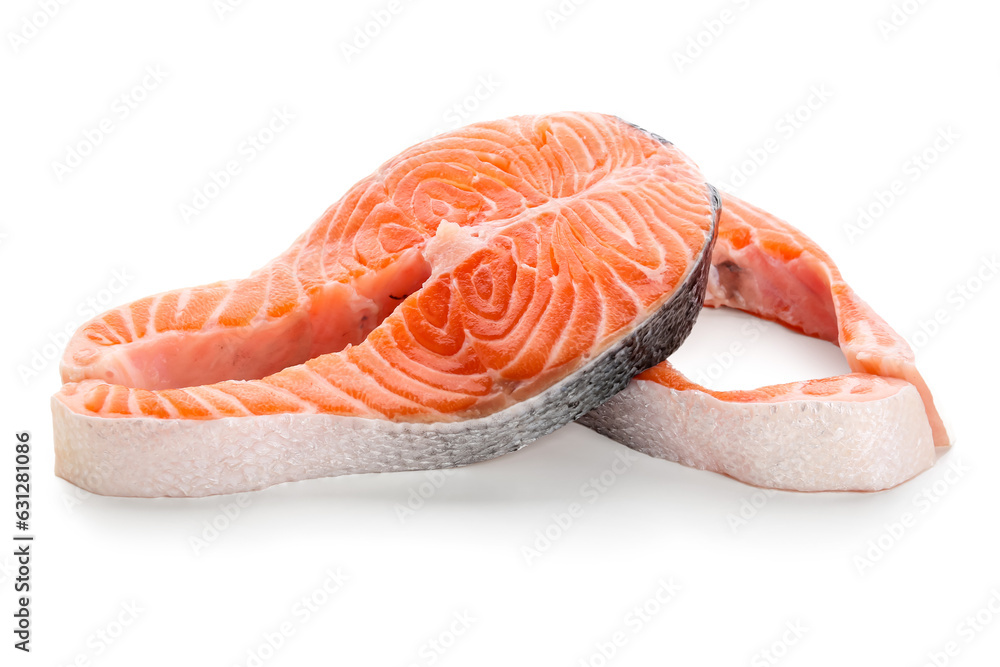 Raw salmon steaks on white background