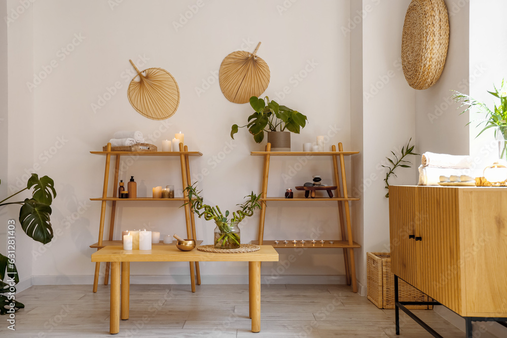 Interior of modern spa salon with burning candles