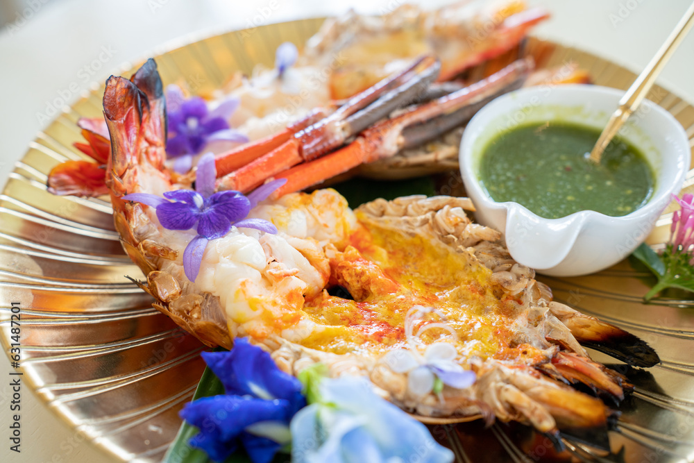 Big shrimp grilled, fresh grilled shrimps on a gold plate on white background. Grilled Shrimps with 