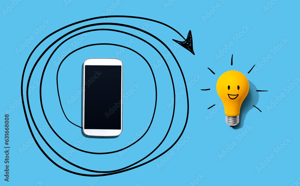 Creativity, inspiration, idea concept with light bulb and smartphone - Flat lay