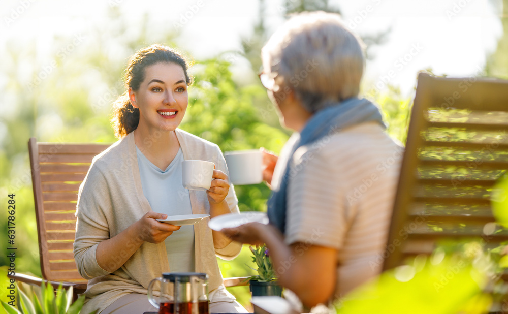 women drinking tea in the garden