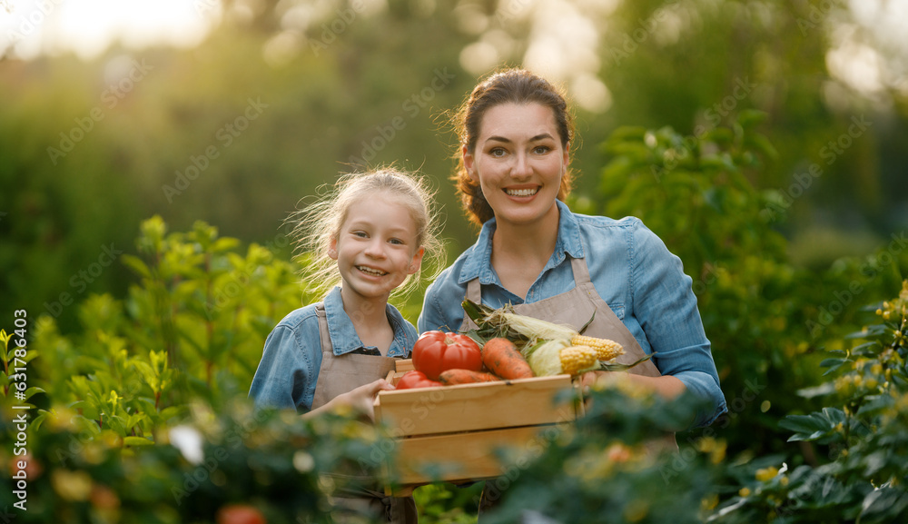 mother and daughter gardening in the backyard