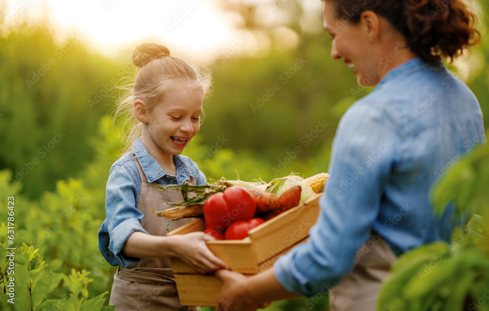 mother and daughter gardening in the backyard