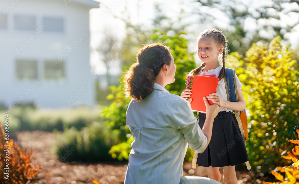 Parent and kid going to school