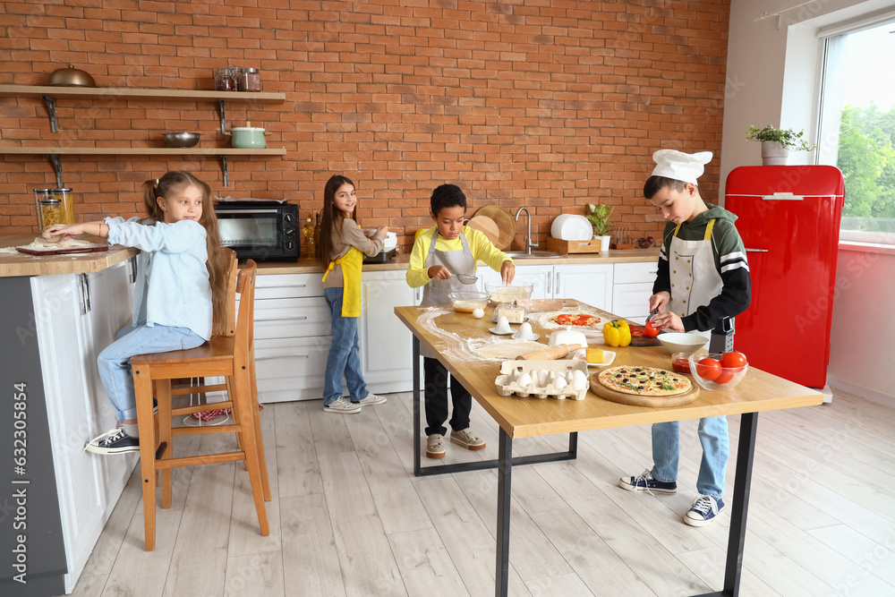 Little children during cooking class in kitchen