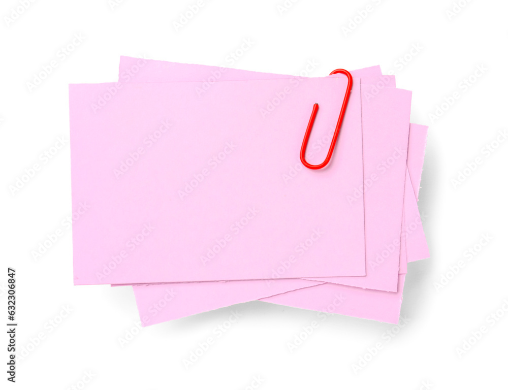 Pink sticky notes with paper clip on white background